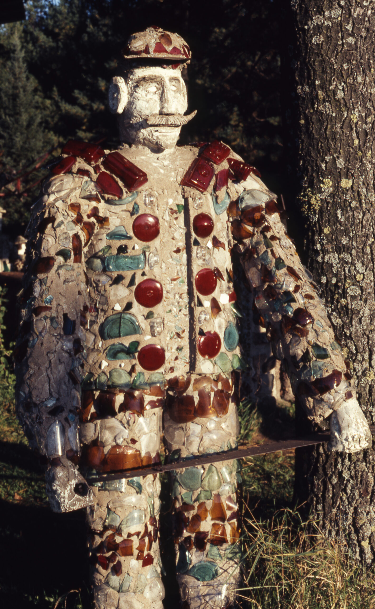Detail shot of one of Smith’s “Paul Bunyan’s Lumberjacks” sculptures, embellished with glass from recycled beer bottles.