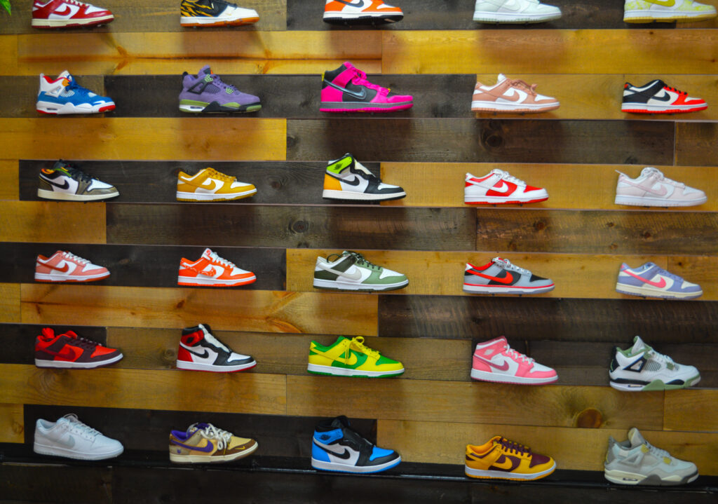 A photo of a wall of Nike sneakers.