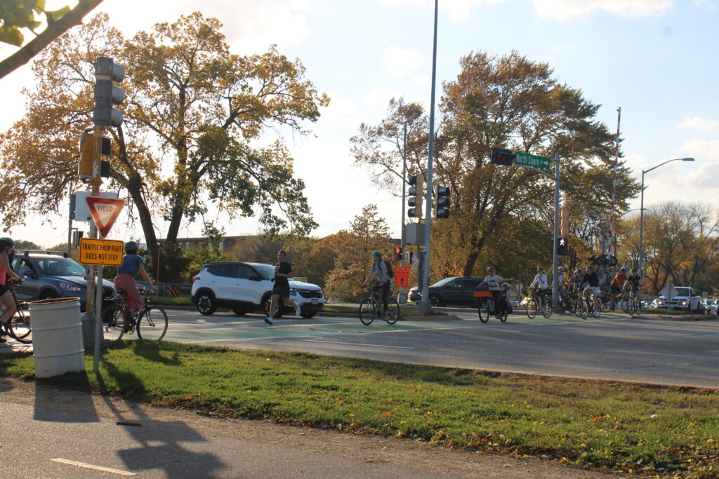 Cyclists and joggers crossing through John Nolen Drive.