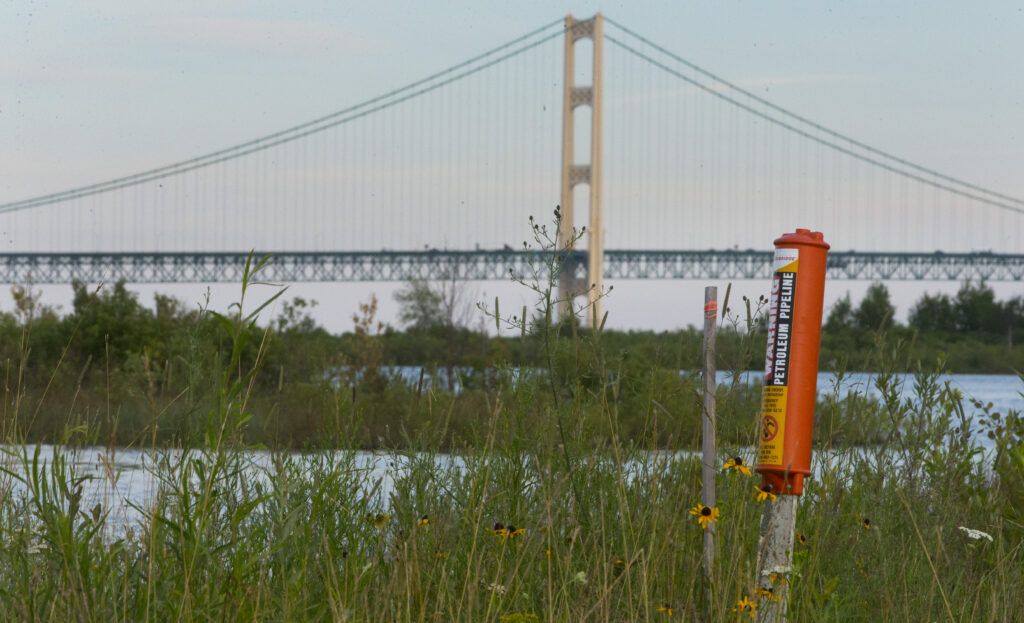 A marker on the shores of Straits of Mackinac indicates where a pipeline enters the water. Courtesy of Mark Hoffman / Milwaukee Journal Sentinel.