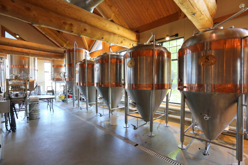 Photo of fermenting tanks arranged in a line at Wisconsin Dells Brewing Co. 