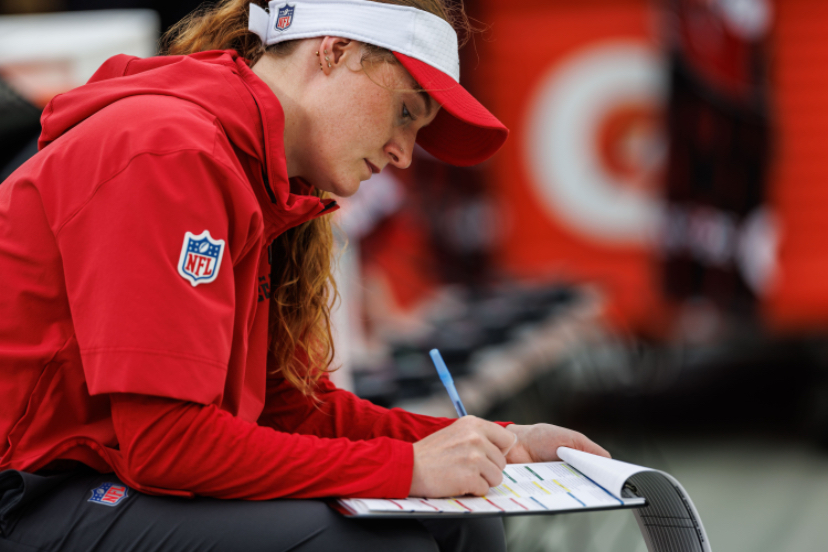 Women writing down notes. 