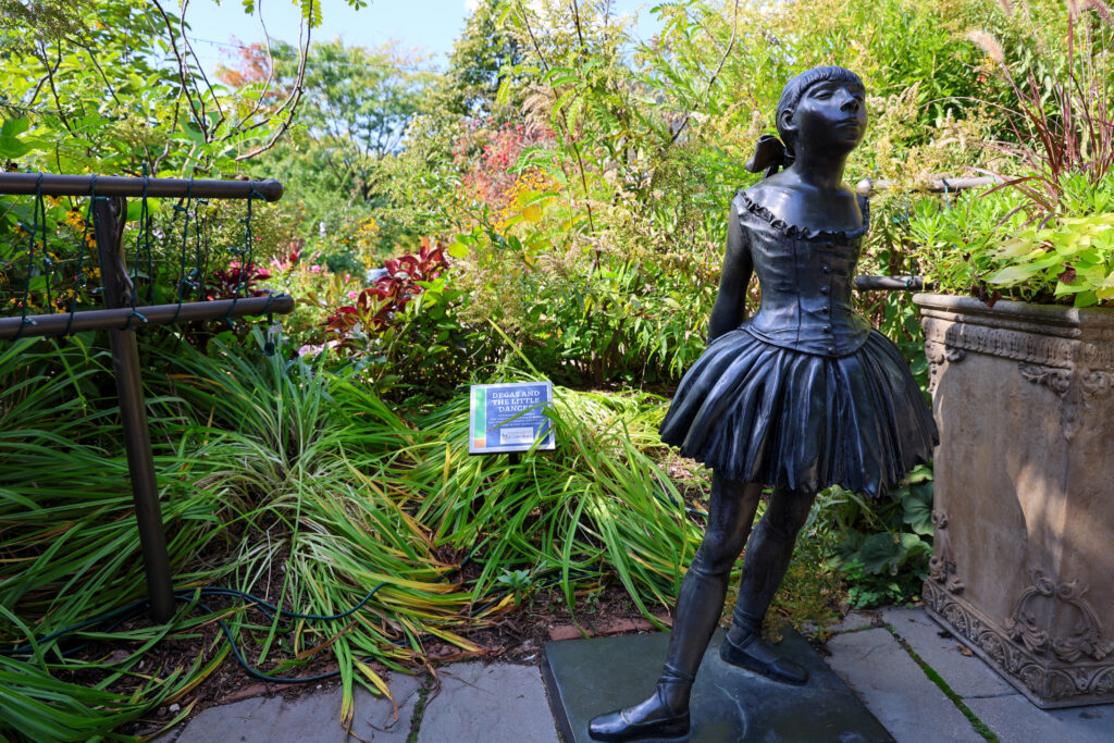 A statue of "The Little Dancer," in Bookworm Gardens.