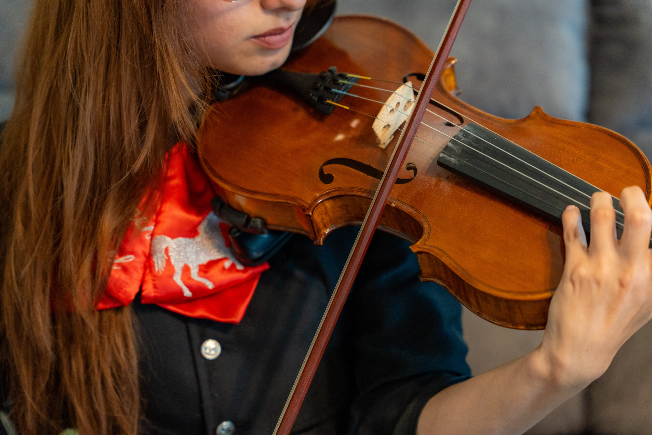 Close-up of woman playing the violin.